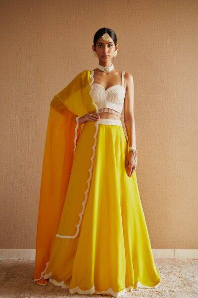 Yellow Silk Cutdana and Sequin Embroidered Blouse with matching Yellow Silk Scallop Embroidered Lehenga and Shaded Yellow and Orange Scallop Embroidered Organza Dupatta with Sequin Chinta work