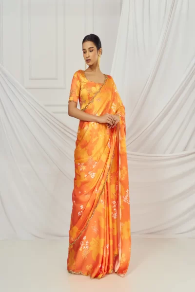 Orange Printed Satin Silk Embroidered Blouse paired with matching Printed Saree with Scallop Embroidery