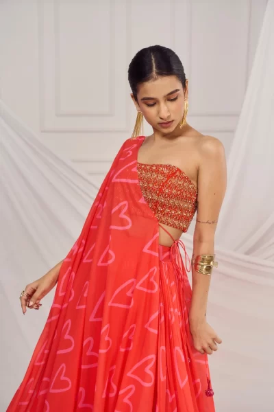 Red Heavy Embroidered Tube Blouse paired with Red Heart Glitter Georgette Skirt and Cape